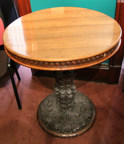 Round carved oak table made from rafters of Crochallan Club of Edinburgh which Burns frequented at Writers' Museum. Edinburgh, Scotland.