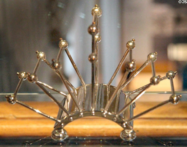 Electroplate letter or toast rack (c1880s) by Christopher Dresser made by JW Hukin & JT Heath of Birmingham, England at National Museum of Scotland. Edinburgh, Scotland.