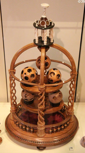 Ornamental stand with wooden balls (1886) by J. Cuthbert displayed at Edinburgh International Exhibition at National Museum of Scotland. Edinburgh, Scotland.