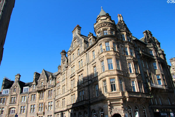 Scots Baronial corner tenement (former bank) (1892-3) (Royal Mile curving onto Cockburn St.). Edinburgh, Scotland. Architect: John MacLachlan.