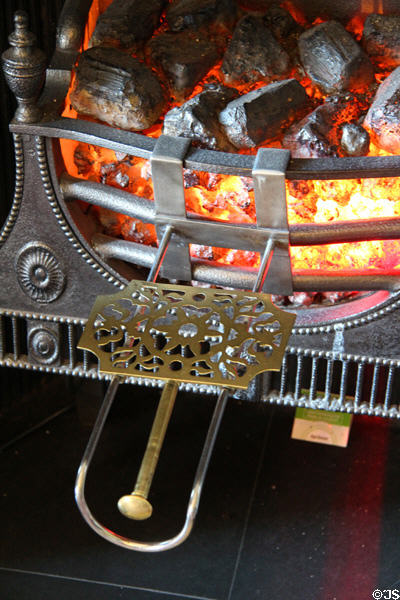Fireplace coal grate with shelf for kettle at Georgian House museum. Edinburgh, Scotland.