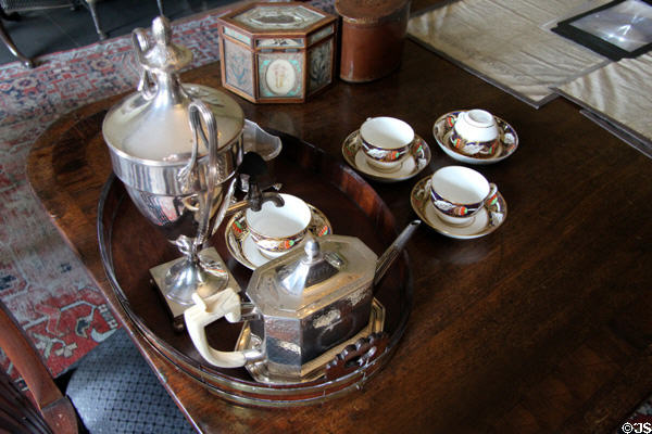 Silver teapot (1788) from Newcastle; silver sugar & creamer (1813) from Edinburgh & Minton teacups (c1810) in parlour at Georgian House museum. Edinburgh, Scotland.