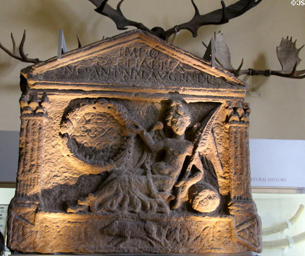 Roman stone carved with reclining figure of Victory from front of Roman Temple in West Dunbartonshire at Hunterian Museum. Glasgow, Scotland.