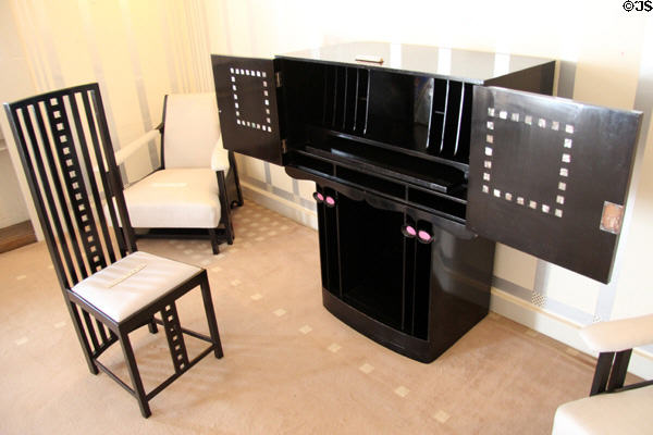 Writing desk (1904) designed to represent Japanese kimono & chair by C.R. Mackintosh with architect's signature rows of squares in drawing room at Hill House. Helensburgh, Scotland.