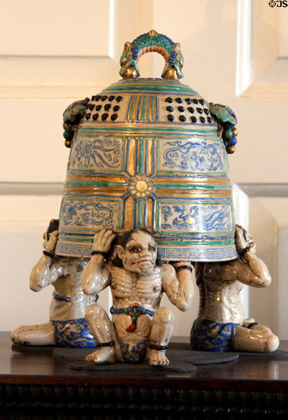 Chinese ceramic of guardians holding bell at Pollok House. Glasgow, Scotland.