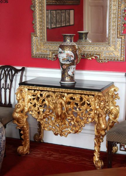 Elaborate gilded table with Chinese porcelain vase in music room at Pollok House. Glasgow, Scotland.