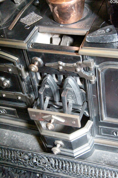 Clothes iron on front of stove at Tenement House museum. Glasgow, Scotland.