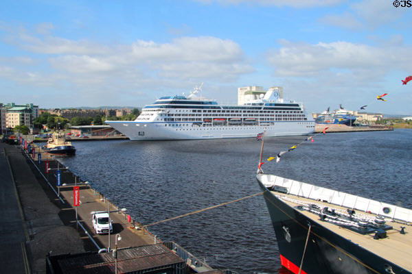 Leith harbor with Cruise ship & bow of Royal Yacht Britannia. Edinburgh, Scotland.
