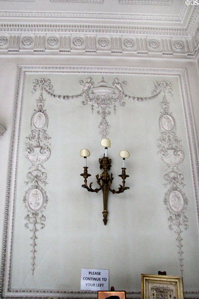 Hall wall sconce with Adamesque themes interpreted by John Kinross in Hall at Manderston House. Duns, Scotland.