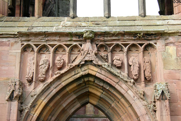 Saints carved over Gothic arch at Melrose Abbey. Melrose, Scotland.