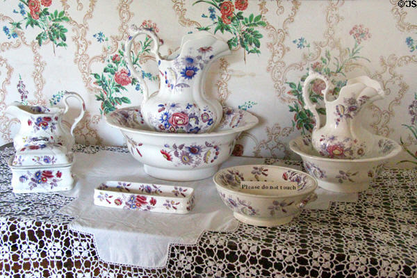 Pitchers & basins in porcelain washing set at Thirlestane Castle. Scotland.