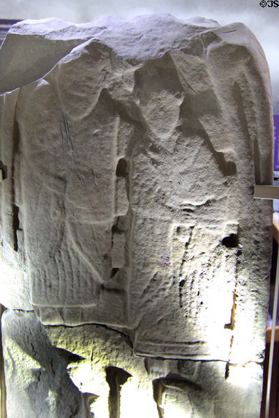 Pictish carved stone with saints in conversation while seated on bench at St Vigeans Museum. Arbroath, Scotland.