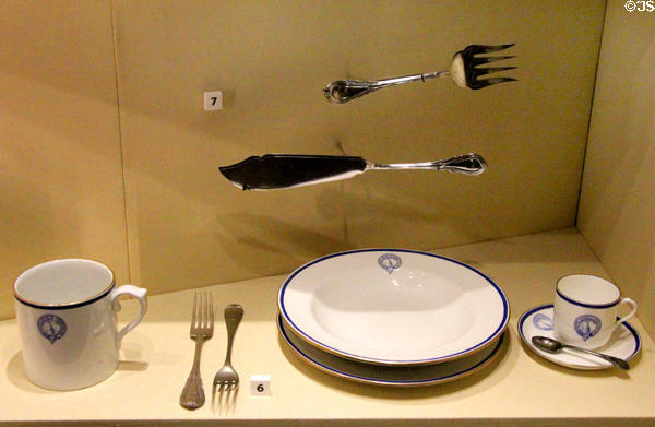 Crockery & cutlery with Antarctica expedition crest at RRS Discovery Museum. Dundee, Scotland.
