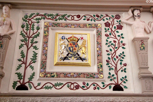 Great hall fireplace details thistles & roses of 1603 union of crowns of Scotland & England at Glamis Castle. Angus, Scotland.