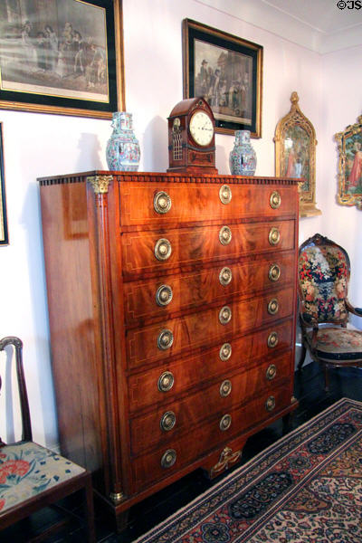 Chest of drawers with clock & vases in Duncan's hall at Glamis Castle. Angus, Scotland.