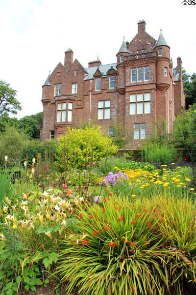 Threave House over flower garden at Threave Garden. Rhonehouse, Scotland.