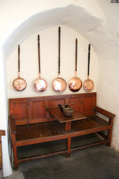 Copper bed warmers over bench with fold down center table at Crathes Castle. Crathes, Scotland.