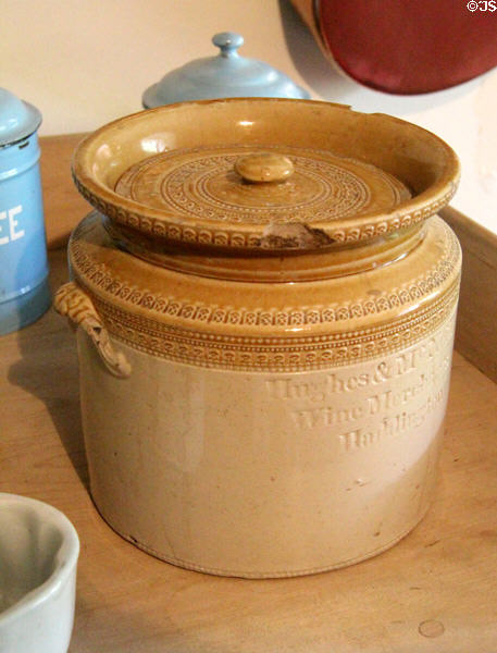 Stoneware storage jar similar to Scottish Portobello pottery marked Hughes & McN� Wine Merchants, Haddington at Crathes Castle. Crathes, Scotland.