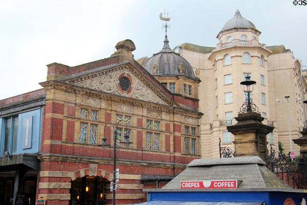 Watershed building, now home to many art activities & weather vane with ship on nearby dome. Bristol, England.
