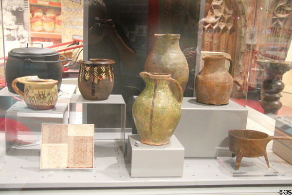 Ceramic pitchers & cooking pots representing some of the objects which were traded at Bristol port over the centuries at M-Shed Museum. Bristol, England.
