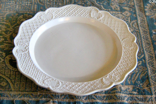 Plate, part of setting on dining room table at Chastleton House. Moreton-in-Marsh, England.