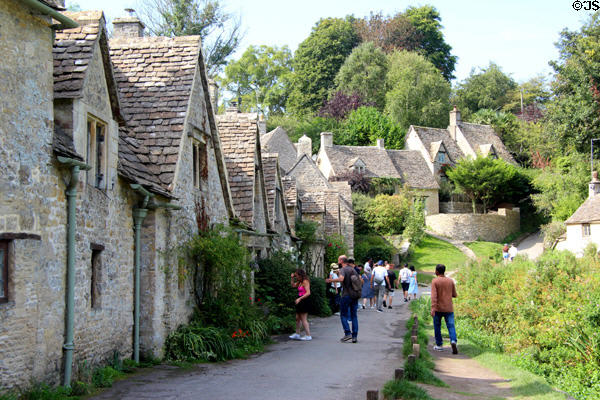 Weavers' cottages with larger homes in background. Bibury, England.