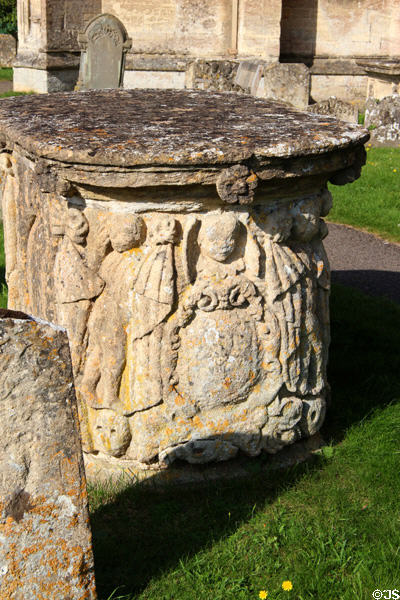 Elaborately carved tomb in cemetery of Church of St Peter & St Paul. Northleach, England.