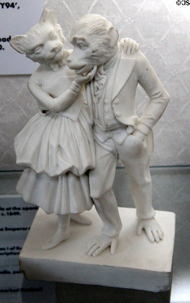 Parian human figure group with heads of cat & monkey (c1850) at Coalport China Museum. Ironbridge, England.
