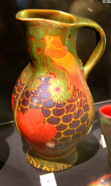 Earthenware jug in lustred colors (c1900) by Zsolnay Factory of Pecs, Hungary at Potteries Museum & Art Gallery. Hanley, Stoke-on-Trent, England.