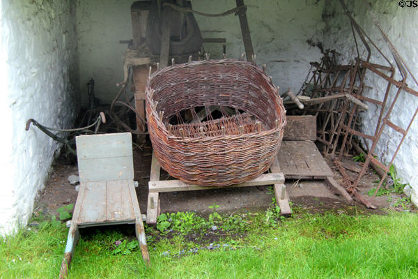 Basket & barrows in outbuilding at Ulster Folk Park. Belfast, Northern Ireland.