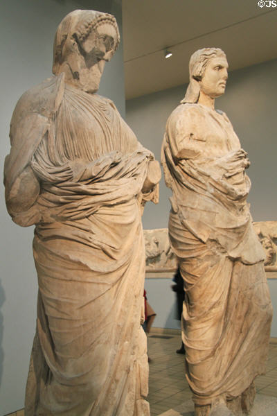 Statue of a woman perhaps wife of Mausollos & man perhaps Mausollos from Mausoleum at Halikarnassos one of seven wonder of ancient world (c350 BCE) Bodrum, Turkey at British Museum. London, United Kingdom.