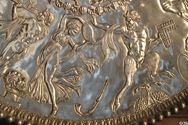 Detail of Mildenhall Treasure Roman tableware silver Great Neptune Dish with relief musical & dancing figures 60.5cm diameter (4thC CE) at British Museum. London, United Kingdom.