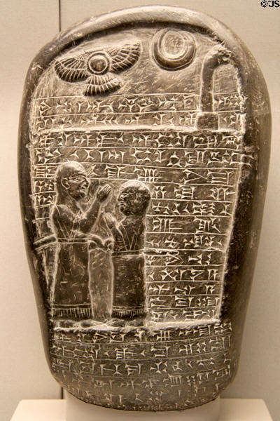 Stone monument with relief of father & son in cuneiform inscription ...