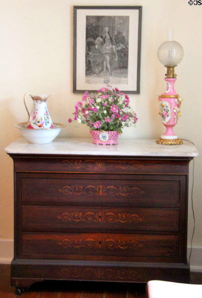 Chest of drawers with scrollwork at Conde-Charlotte Museum. Mobile, AL.