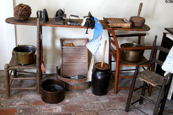 Ironing board across two chairs with washing items at Conde-Charlotte Museum. Mobile, AL.