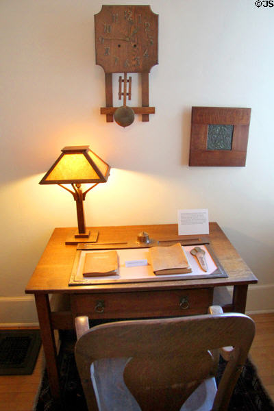 Wall clock by Sessions Clock Co. of Forestville, CT, framed tile with star by Rookwood Architectural Faience & Roycroft desk blotter in Corbett House at Tucson Museum of Art. Tucson, AZ.
