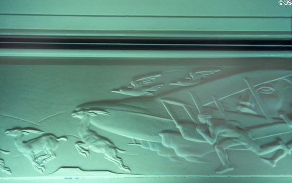 Art deco panel in Queen Mary showing airplane racing men, gazelles & birds. Long Beach, CA.