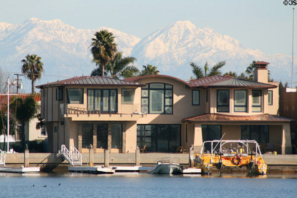 Seal Beach home against distant snow-covered mountains. Long Beach, CA.