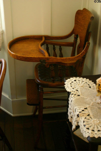 Wooden high chair in parlor of Nixon Birthplace used by Richard Nixon & his brothers. Yorba Linda, CA.