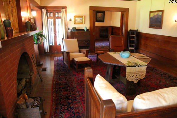 Parlour with arts & crafts furniture & arched fireplace at Marston House Museum. San Diego, CA.
