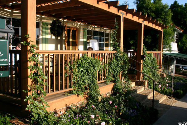 Spanish colonial style porch used for outside dining of restaurant. Rancho Santa Fe, CA.