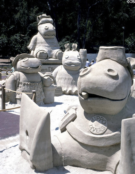 Sand sculptures of comical Hippos in bikinis. San Diego, CA.
