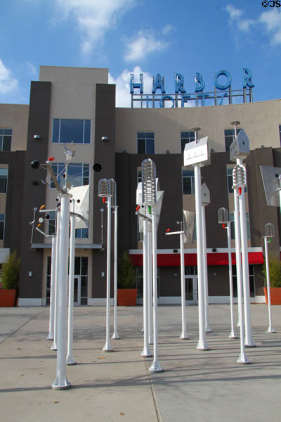 Bird houses sculpture group (c1995) by Peter Shire before Harbor Lofts Building. Anaheim, CA.