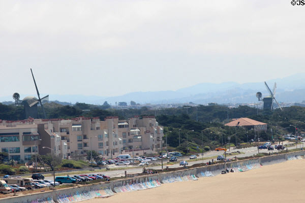 Two windmills mark points where Golden Gate Park meets Pacific Ocean seen from Cliff House. San Francisco, CA.