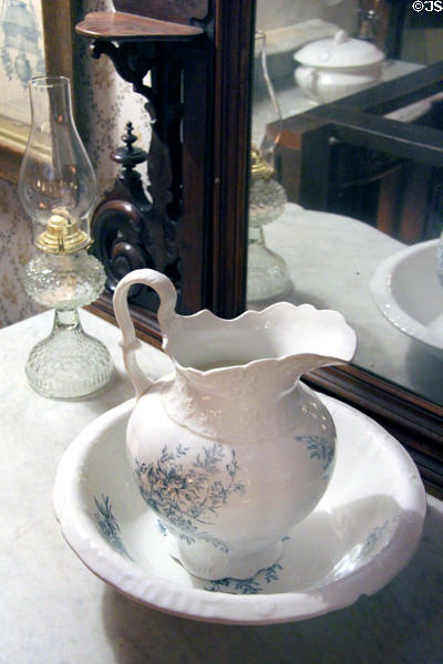 Wash basin, pitcher & glass oil lamp at Mariposa Museum. Mariposa, CA.