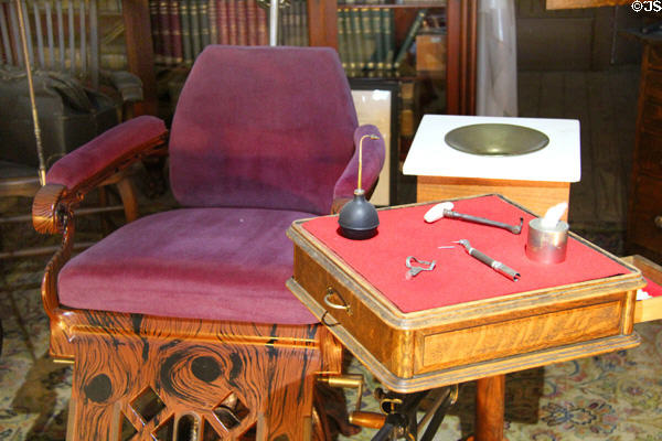 Dental chair & tools on table in dentist's office at Columbia State Historic Park. Columbia, CA.