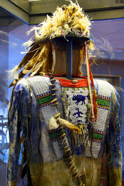 Beaded Oglala headdress & shirt used in 1920s Broadmoor Hotel performances at El Pomar Carriage Museum. Colorado Springs, CO.