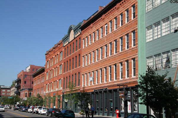Streetscape of heritage buildings along Wazee Street from 16th St. Mall. Denver, CO.