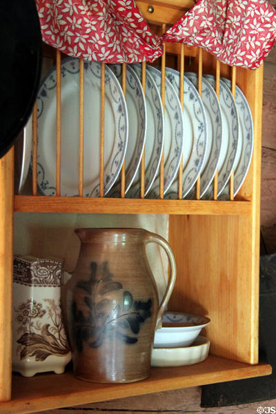 Dishes & stoneware pitcher at 1860's Galloway Homestead log cabin at Rock Ledge Ranch Historic Site. Colorado Springs, CO.