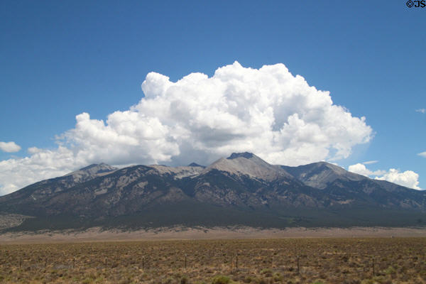 Clouds over mountains of Great Sand Dunes National Park. CO.